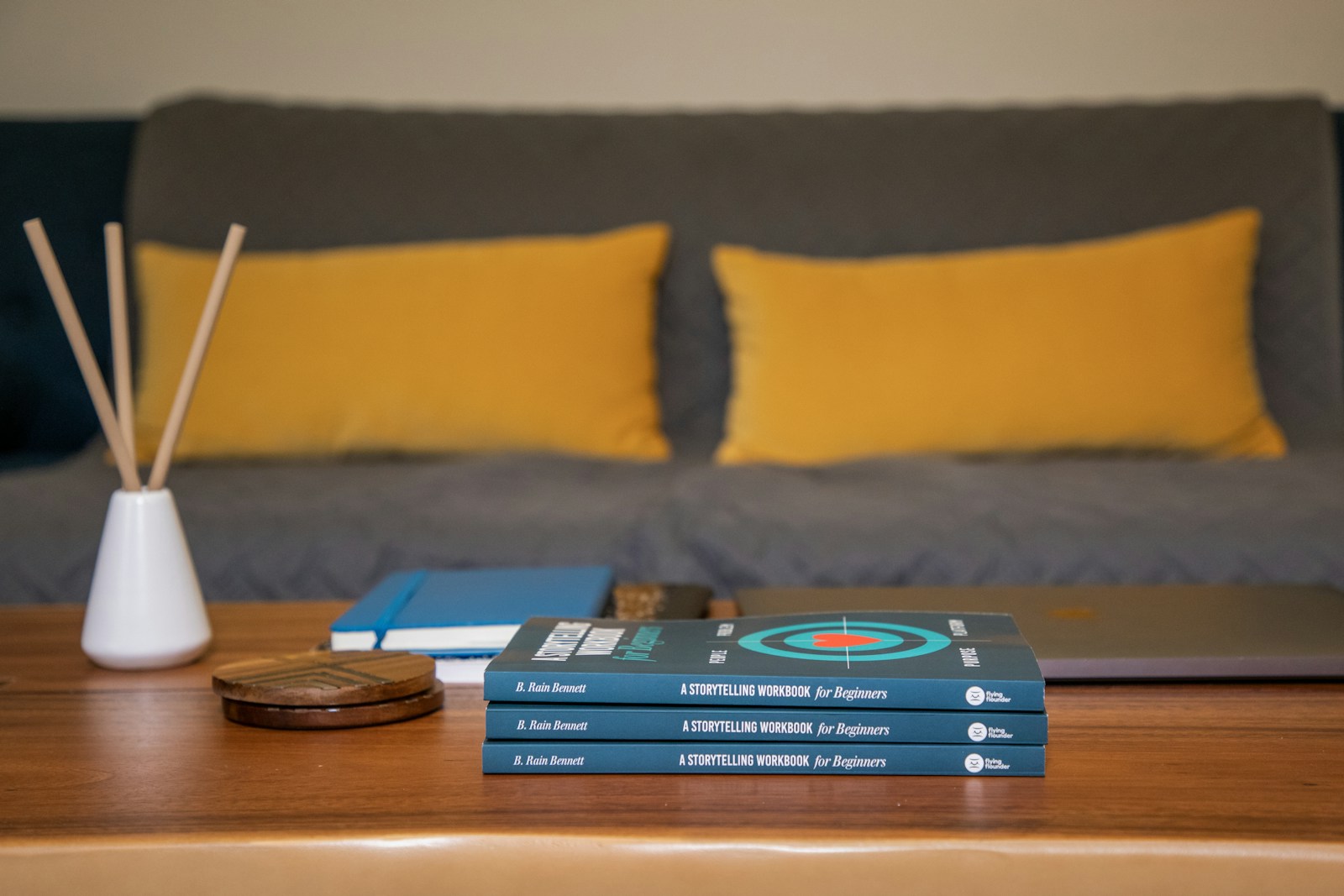 blue and yellow book on brown wooden table