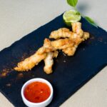 fried chicken on black rectangular plate