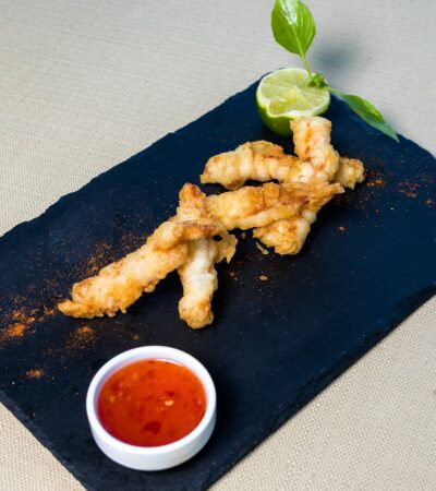 fried chicken on black rectangular plate